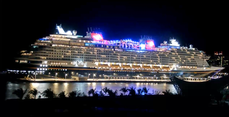 Disney Wish docked at Nassau at night.
