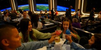 Family enjoying dining at EPCOT's Space 220 restaurant.