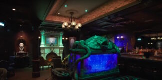 The Haunted Mansion Parlor lounge on the Disney Treasure.