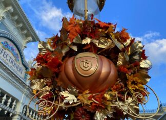 Mickey’s Not So Scary Halloween Party is Starting Earlier Than Ever in 2026 Cinderella pumpkin decoration on a light post at Magic Kingdom.