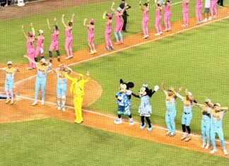 Banana Ball Returning to Disney World With All 6 Teams Banana Ball founder Jesse Cole, Mickey Mouse, and Minnie Mouse dancing during a Banana Ball game.