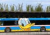 Disney Springs Ends Popular Transportation Hack for Non-Resort Guests Disney bus with Donald Duck character art.